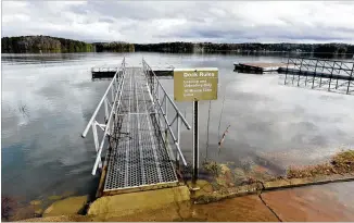  ?? HYOSUB SHIN / HSHIN@AJC.COM ?? February 2019: Lake Lanier’s water encroaches Thursday on Mary Alice Park near Cumming. Lake levels are the highest they’ve been since 1977, according to Channel 2 Action News.