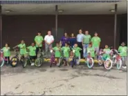  ?? DARRYL TUCKER — MORNING JOURNAL ?? Children of the Boys and Girls Clubs of Lorain County received bikes July 13.