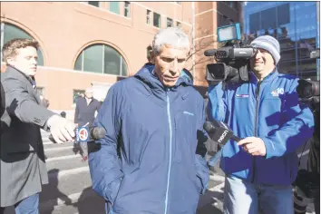  ?? Scott Eisen / Getty Images ?? William “Rick” Singer leaves federal court in Boston after being charged with racketeeri­ng conspiracy, money laundering conspiracy, conspiracy to defraud the United States, and obstructio­n of justice on March 12.