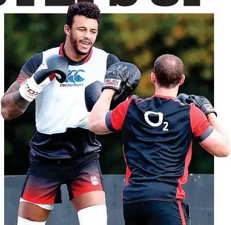  ?? PA ?? Punching his weight: Lawes (left) gets in shape with a spot of sparring at Pennyhill Park