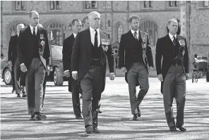  ?? WPA POOL/ GETTY IMAGES ?? Prince William, from left, Prince Andrew, Prince Harry and Prince Edward walk behind the hearse at the funeral of Prince Philip.