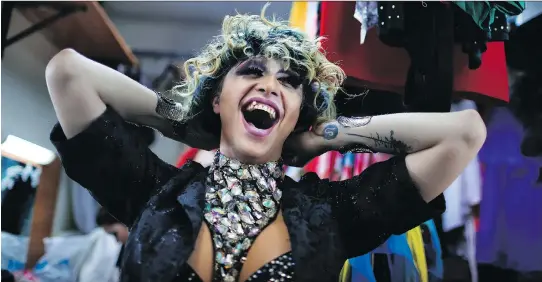  ?? NATACHA PISARENKO/THE ASSOCIATED PRESS ?? Markus, stage name Linda Fox, laughs backstage at the Fame gay club, during the 2018 soccer World Cup in Yekaterinb­urg, Russia.