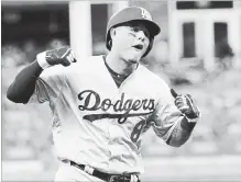  ?? JOHN BAZEMORE THE ASSOCIATED PRESS ?? Dodger Manny Machado celebrates his three-run homer in the seventh. L.A. took the series three games to one and next face Milwaukee.