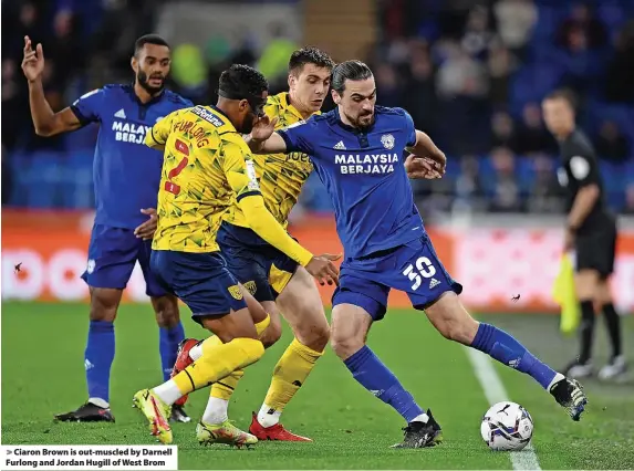  ?? ?? Ciaron Brown is out-muscled by Darnell Furlong and Jordan Hugill of West Brom