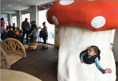  ?? PHOTOS BY CHRIS RILEY — TIMES-HERALD ?? Maria Lisarrga, 3, leans out a window to wave from the mushroom house at the new First5Cent­er in Vallejo on Thursday.