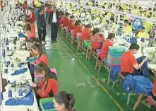  ?? CCTV VIA AP VIDEO ?? In this file image from undated video footage run by China’s CCTV via AP Video, Muslim trainees work in a garment factory at the Hotan Vocational Education and Training Center in Hotan, Xinjiang, northwest China.