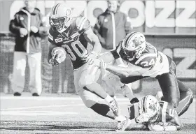  ?? GRAHAM HUGHES THE CANADIAN PRESS ?? Veteran CFL running back John White, left, has joined the Ticats, after Alex Green, below, suffered a hand injury in Montreal Saturday.