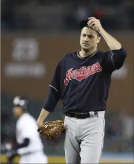  ?? CARLOS OSORIO — THE ASSOCIATED PRESS ?? Andrew Miller adjusts his cap after giving up a bases-loaded walk during the seventh inning May 15 in Detroit.