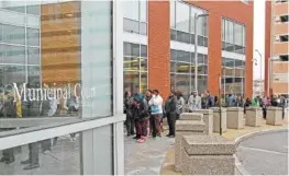  ?? THE ASSOCIATED PRESS ?? The line of people stretches outside the Public Safety building in Providence, R.I. The Rhode Island court was flooded with people contesting speeding tickets Monday after a new school zone speed camera program resulted in 12,000 tickets in 33 days.