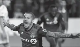  ?? The Canadian Press ?? Toronto FC forward Sebastian Giovinco celebrates his game-winning goal in second half Canadian Championsh­ip soccer action against the Montreal Impact, in Toronto on Tuesday.