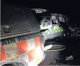  ??  ?? > Damaged vehicles and equipment at the Central Beacons Mountain Rescue Team in Dowlais