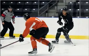  ?? NEWS PHOTO JAMES TUBB ?? Medicine Hat Tigers forward Cayden Lindstrom stops up with the puck in the final scrimmage of the Tigers training camp on Sunday.