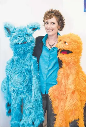  ?? Picture: Nev Madsen ?? COLOURFUL PUPPETS: Marianne Buchanan has brought her theatre business to Toowoomba.