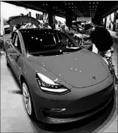  ?? DAVID ZALUBOWSKI/AP ?? The Tesla Model 3’s electronic driver assist system was one of five tested by the Insurance Institute for Highway Safety.