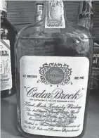  ?? SILVER DOLLAR PROVIDED BY THE ?? This unopened Cedar Brook from 1917 is the oldest bottle of bourbon in The Silver Dollar's collection.