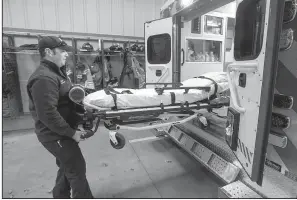  ?? NWA Democrat-Gazette/BEN GOFF ?? Ramsey Emerson, a firefighte­r and emergency medical technician, talks earlier this month about the equipment on an ambulance at a Rogers fire station.