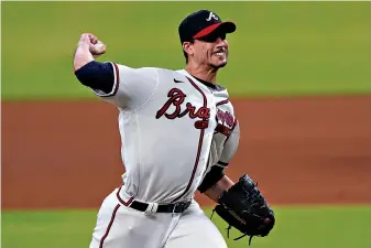  ?? AP Photo/John Bazemore ?? Atlanta Braves starting pitcher Charlie Morton works against the St. Louis Cardinals batter during the seventh inning of a baseball game Thursday in Atlanta. Morton took a no-hitter into the seventh inning.