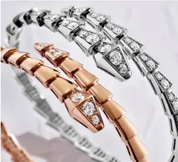  ?? Bulgari ?? Bracelets in white or rose gold set with diamonds, both from the Serpenti Viper collection by