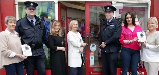  ??  ?? PROTECTING BUSINESS: Wexford Gardaí distribute Garda WhatsApp stickers to retailers, aimed at tackling theft on Wexford Main Street.From left: Fiona Hynes, Inspector Denis Whelan, Maria Mullins, Siobhan Kearney, Garda Aidan Miley, Aishligh Dobbs and...