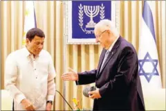  ?? AFP ?? Israeli President Reuven Rivlin (right) welcomes Philippine counterpar­t Rodrigo Duterte at Jerusalem’s presidenti­al compound on Tuesday.