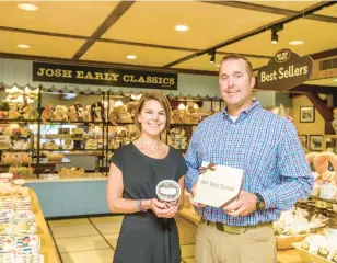  ?? GAMIZ/THE MORNING CALL APRIL ?? Siblings Barry Dobil Jr. and Amy Barnett in the retail shop at Josh Early Candies in South Whitehall Township. The fifth-generation family business continues to use the same batch of recipes developed in the early 1900s.