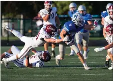  ?? JEN FORBUS — FOR THE MORNING JOURNAL ?? Rocky River’s Ryan Ricketti, left, lunges for a tackle attempt on Midview’s Dane West last season.