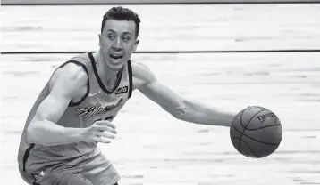  ?? MARTA LAVANDIER AP ?? ‘They’re being physical and just trying to knock it down and not letting me get to it,’ Duncan Robinson said of how teams are defending his dribble handoffs with Bam Adebayo this season.