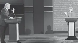  ??  ?? Donald Trump and Hillary Clinton sparred Monday night in the first of three presidenti­al debates. Clinton took everything Trump tried to throw at her and went on the attack as well.