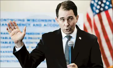  ?? JIM MATTHEWS/AP ?? Wisconsin Gov. Scott Walker defends the measures he signed as improving transparen­cy, stability and accountabi­lity.