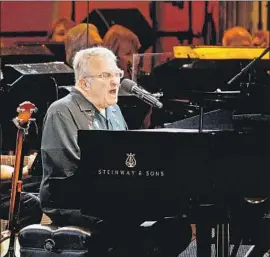  ?? Patrick T. Fallon For The Times ?? AT THE BOWL on Sunday, Randy Newman surveyed his 50-year-plus career, performing solo on piano as well as with a rock band and the Bowl orchestra.