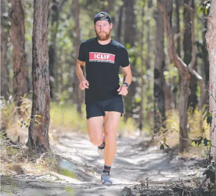  ?? Picture: GLENN HAMPSON ?? Currumbin resident Sam Weir training for the 200 Miler trail-running race at Nerang.