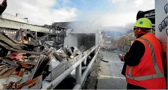  ?? ROBYN EDIE/STUFF ?? Project manager Russell Clouston surveys demolition work on the site for the planned $40 million hotel in Invercargi­ll.