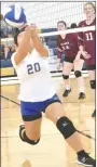  ?? Westside Eagle Observer/MIKE ECKELS ?? After running from her position at midcourt, Lady Bulldog Lilly Lee manages to pass the ball over her head to a teammate during the Decatur-Alpena conference volleyball match in the Decatur Middle School gym Sept. 24.