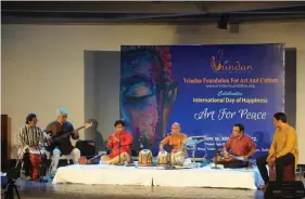  ?? ?? Arunangshu Chaudhury on the tabla and his team performing during the event.