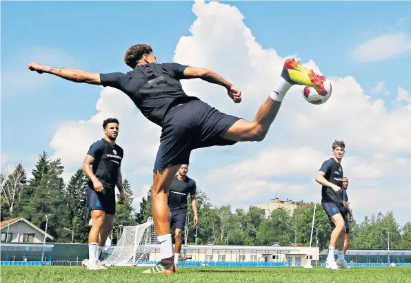  ??  ?? Skill set: Dele Alli controls the ball during a training session near St Petersburg as England players prepare for their third-place play-off