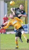  ??  ?? Fort’s Michael Ellis and Brora captain Jamie Duff in action.