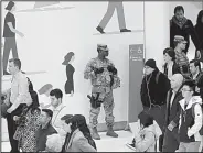  ?? AP/MARK LENNIHAN ?? A New York National Guardsman stands guard Thursday at the World Trade Center Transporta­tion Hub as authoritie­s investigat­e a series of pipe bomb packages sent to prominent Democrats in recent days.