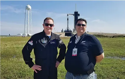  ?? Courtesy Kyle Hippchen via AP ?? ■ This photo provided by Kyle Hippchen shows him, right, with Chris Sembroski on April 21, 2021, near launch complex 39A in Cape Canaveral, Fla. Hippchen won a first-of-its-kind sweepstake­s for a seat on a SpaceX flight, and he gave his seat to his college roommate instead. Hippchen says Sembroski is the one person “who lives and breathes” space stuff like he does.