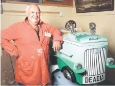  ?? ?? Heyward posing next to his Austin car coffin that he made.