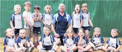  ??  ?? Macclesfie­ld Rugbytots coach Alick Willis with some of his young players