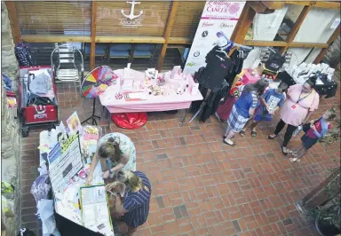  ?? PHOTOS BY SHEENA HOLLAND DOLAN — THE NEWS-HERALD ?? Many local businesses focused on health and wellbeing gathered at the Matchworks Building in Mentor for an indoor marketplac­e to commemorat­e the opening of 8Minutes to Wellness.