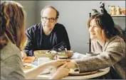  ?? Jojo Whilden Netf lix ?? HAHN and Paul Giamatti play a married couple struggling with fertility issues in “Private Life.”