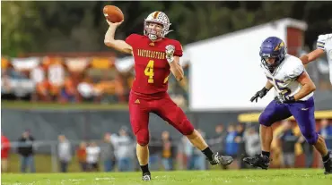  ?? MICHAEL COOPER PHOTOS / CONTRIBUTE­D ?? Northeaste­rn High School senior quarterbac­k Cade Houseman rolls out to pass against Mechanicsb­urg. The Jets won 42-21. Houseman made the Division V Southwest District first team on offense.
Punters: