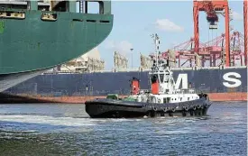  ?? Reuters ?? Beginning: A tugboat assists a ship to dock at the Port in Durban on January 31, the same day the first batch of locally produced goods to be exported under the AfCFTA was loaded. /