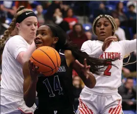  ?? (Arkansas Democrat-Gazette/Thomas Metthe) ?? Fayettevil­le senior guard Coriah Beck (14) goes up for a shot between Fort Smith Northside’s Tracey Bershers (left) and Eriel West during Fayettevil­le’s 55-53 victory over Fort Smith Northside in the Class 6A girls state semifinal Saturday in Bryant. Beck scored a game-high 24 points to lead the Lady Bulldogs to the championsh­ip game. See more photos at arkansason­line.com/38girls6a/