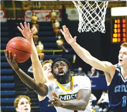  ?? STAFF PHOTO BY MATT HAMILTON ?? UTC’s David Jean-Baptiste shoots against The Citadel on Saturday at McKenzie Arena.