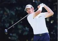  ?? Sam Greenwood / Getty Images ?? Patrick Cantlay plays his shot from the 14th tee during the second round of the Tour Championsh­ip on Friday in Atlanta.