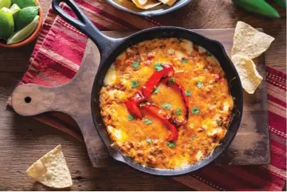  ?? GETTY IMAGES ?? Queso Fundido is sure to be a Super Bowl snack hit.
