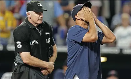  ?? CHARLIE RIEDEL — THE ASSOCIATED PRESS ?? Boston Red Sox manager Alex Cora argues a call with home plate umpire Bill Welke during the seventh inning of a baseball game against the Kansas City Royals Thursday, Aug. 4, 2022, in Kansas City, Mo.