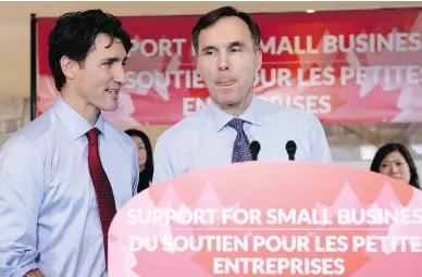  ?? NATHAN DENETTE / THE CANADIAN PRESS ?? Finance Minister Bill Morneau and Prime Minister Justin Trudeau discuss tax reforms in Stouffvill­e, Ont., Monday.